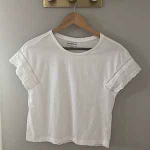 Cropped white tee with eyelet detail on sleeves
